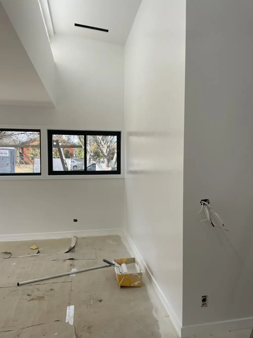 Fresh interior painting work with smooth light walls and ceiling