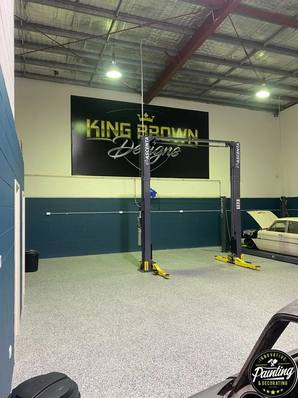Finished commercial workshop interior with painted walls and speckled flooring