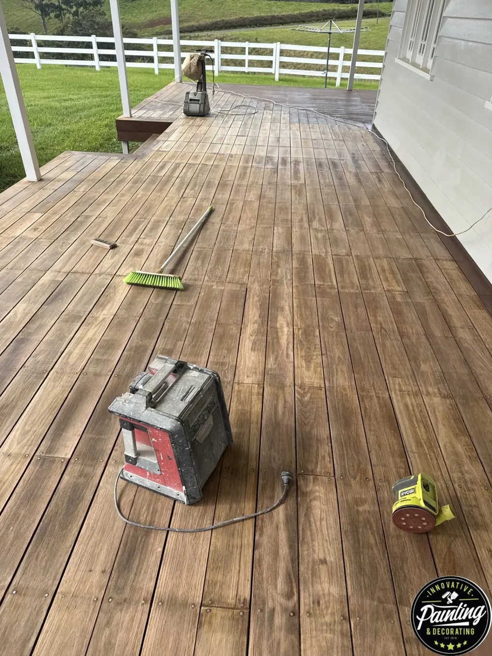 Timber deck during preparation with restoration tools and equipment