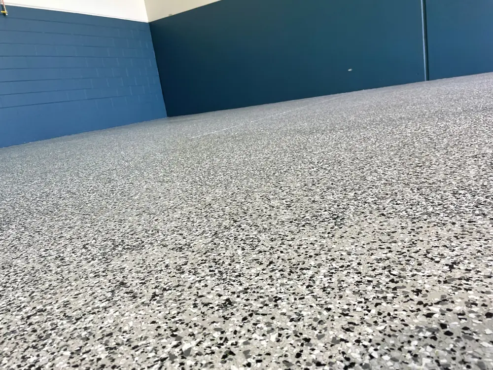 Close view across a finished grey speckled epoxy floor