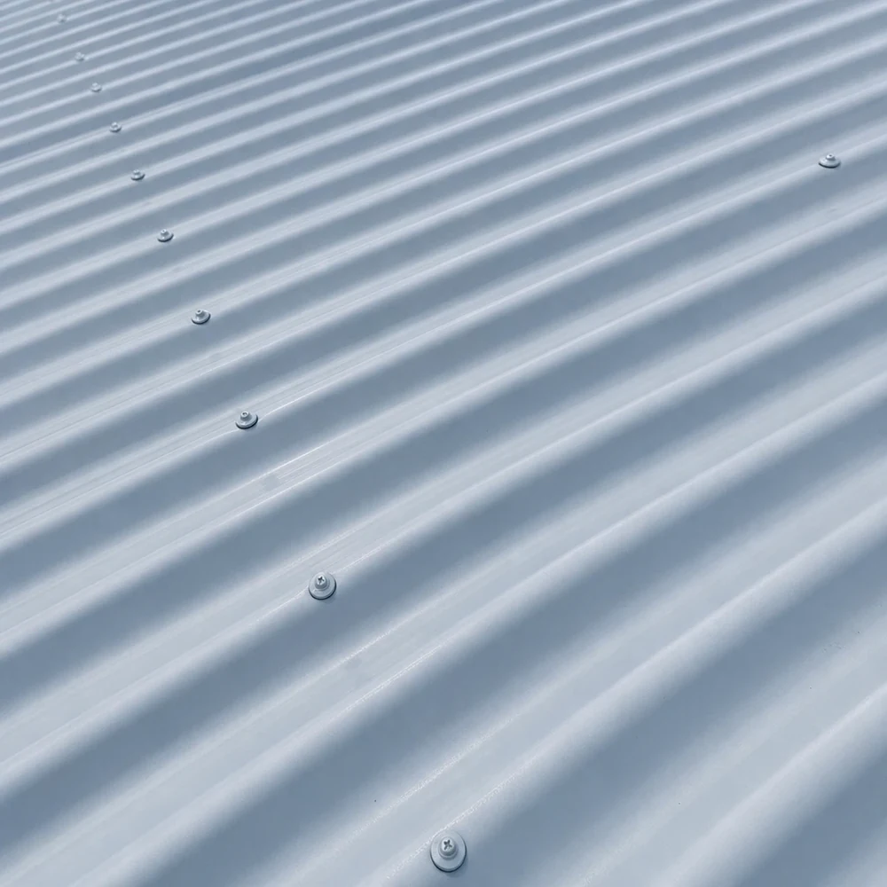 Close-up of pale blue-grey Colorbond roofing with evenly spaced ribs