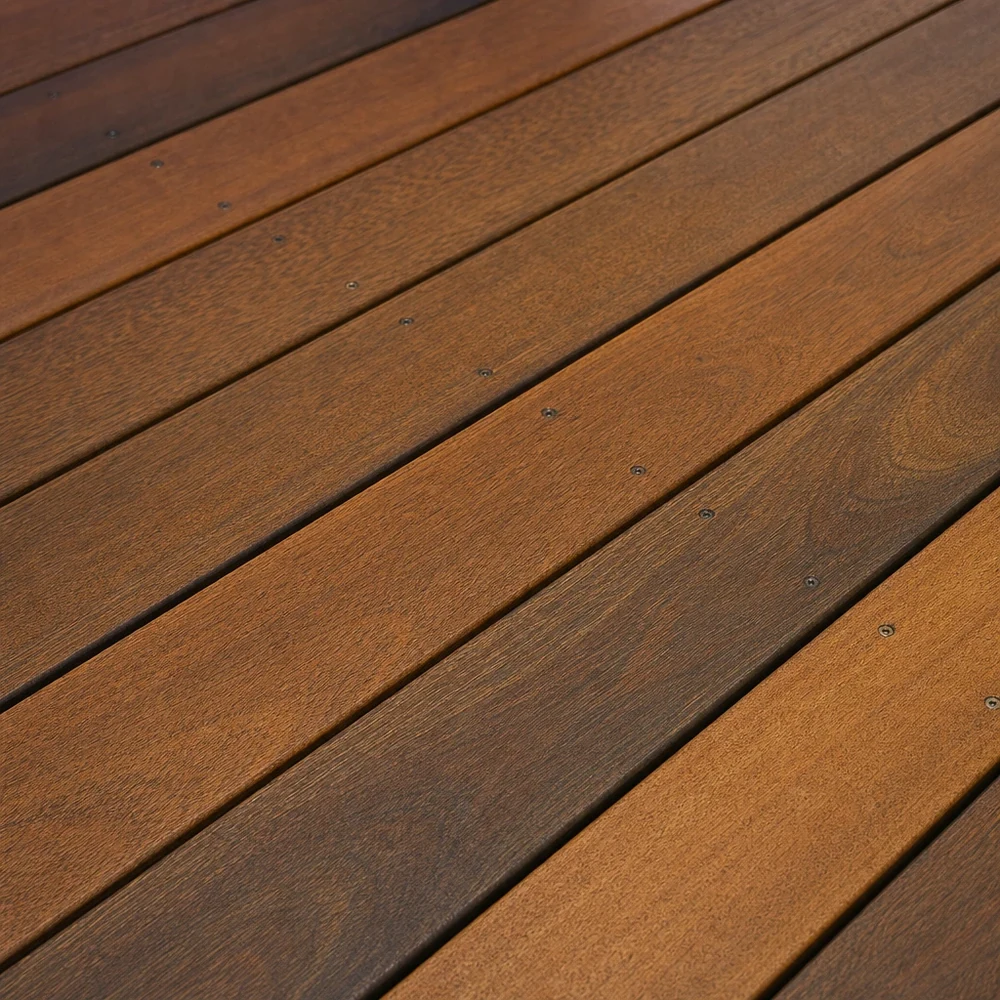 Close-up of warm restored timber deck boards with visible natural grain