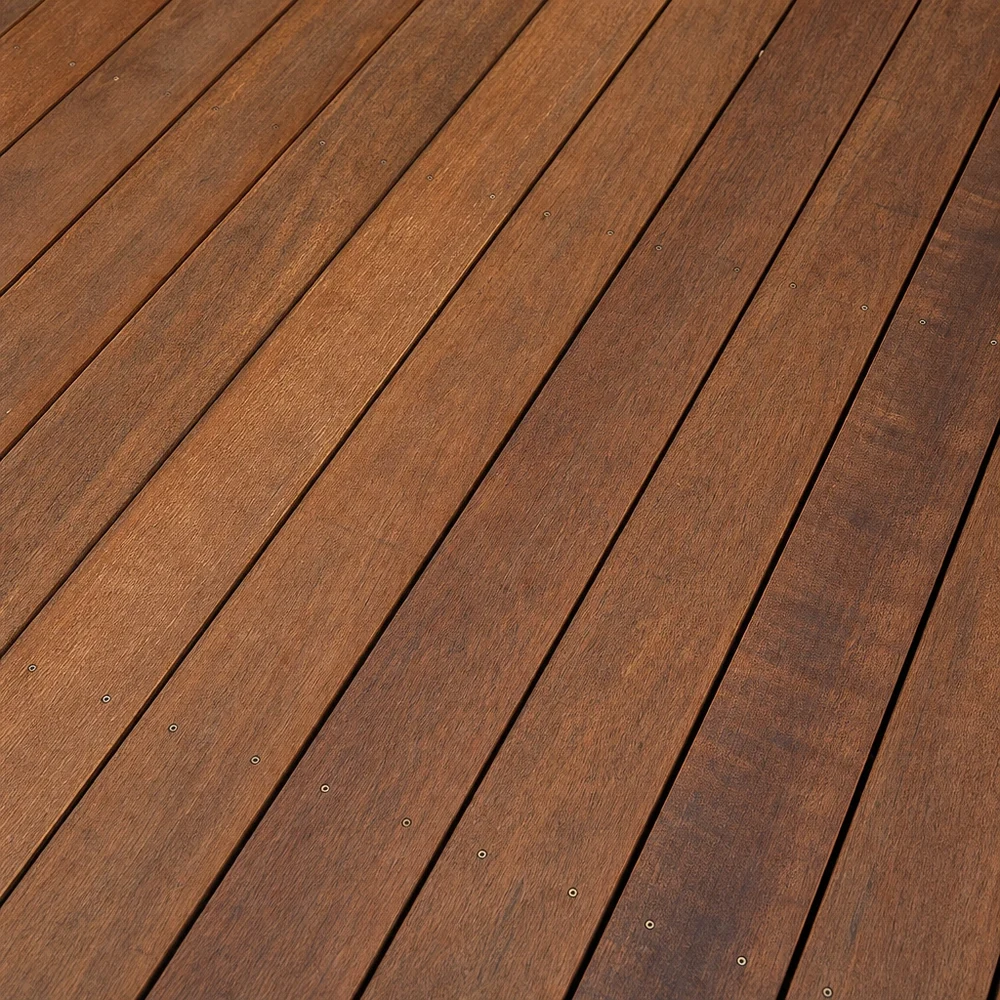 Close-up of golden-brown restored timber deck boards with diagonal lines